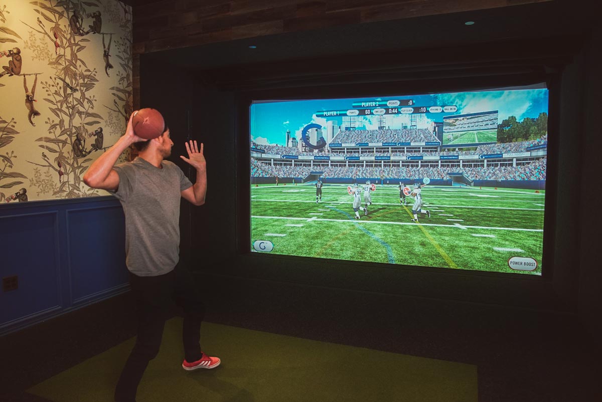 Playing simulated football in a bay at Golfer's Den
